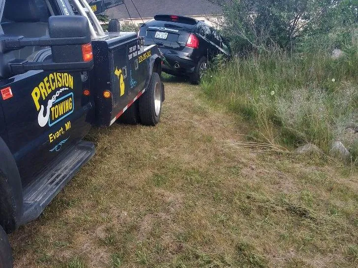 Precision Towing wrecker on an auto recovery call in Osceola County