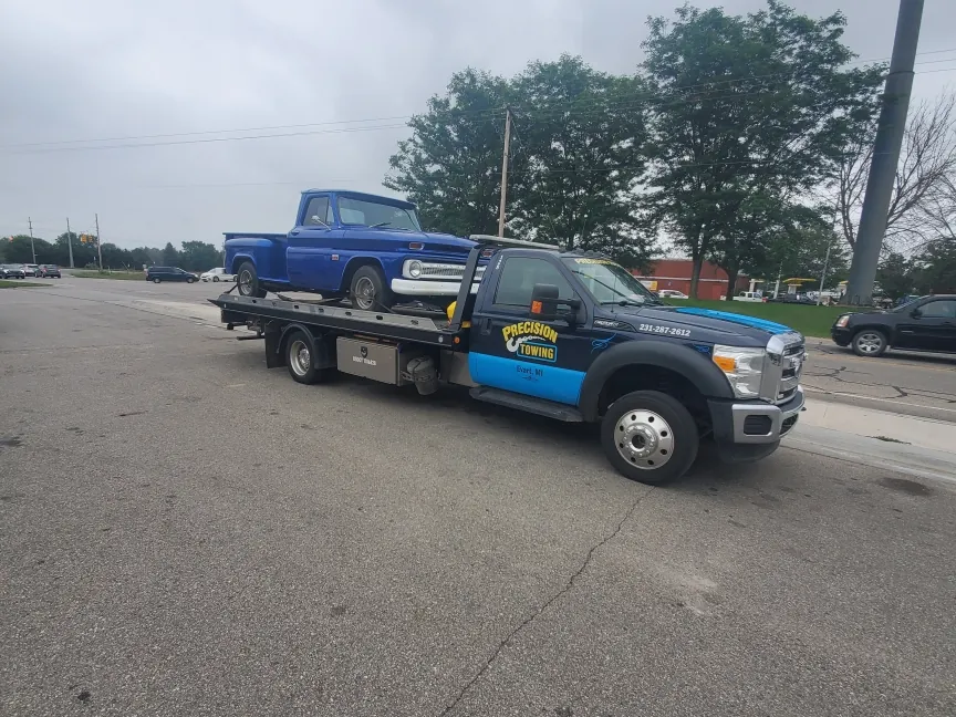 Classic car secured on a Precision Towing rollback